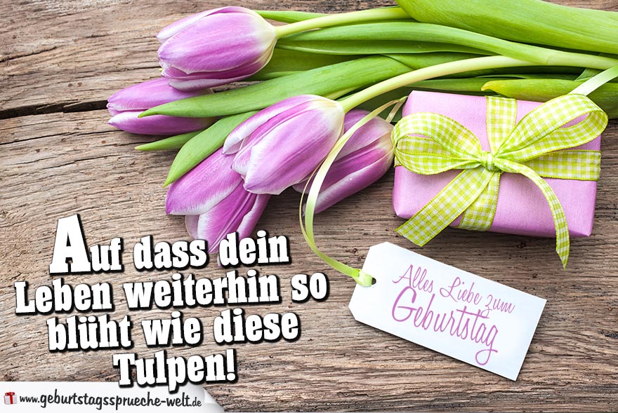 Schöne Geburtstagskarte mit lilafarbenen Tulpen, kleinen Geschenk und Zettel